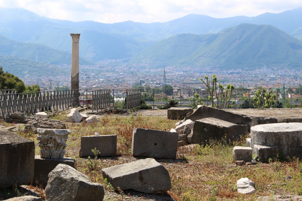 spectacular scenery provides an idyllic backdrop to the scene of ruin and devastation, what remains of Pompeii